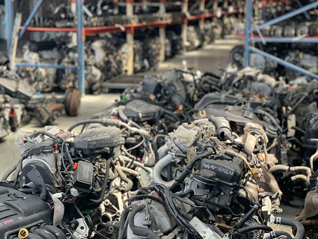 Used engine assemblies arranged in a parts warehouse